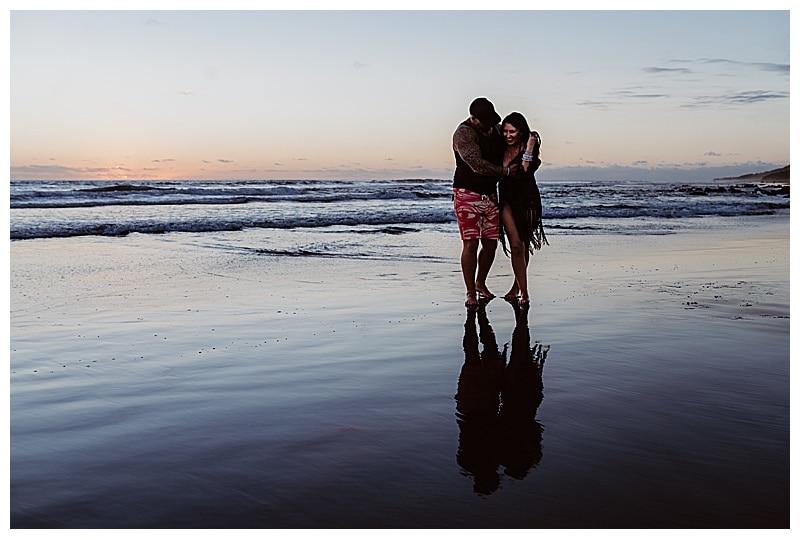 couple hugging on the beach