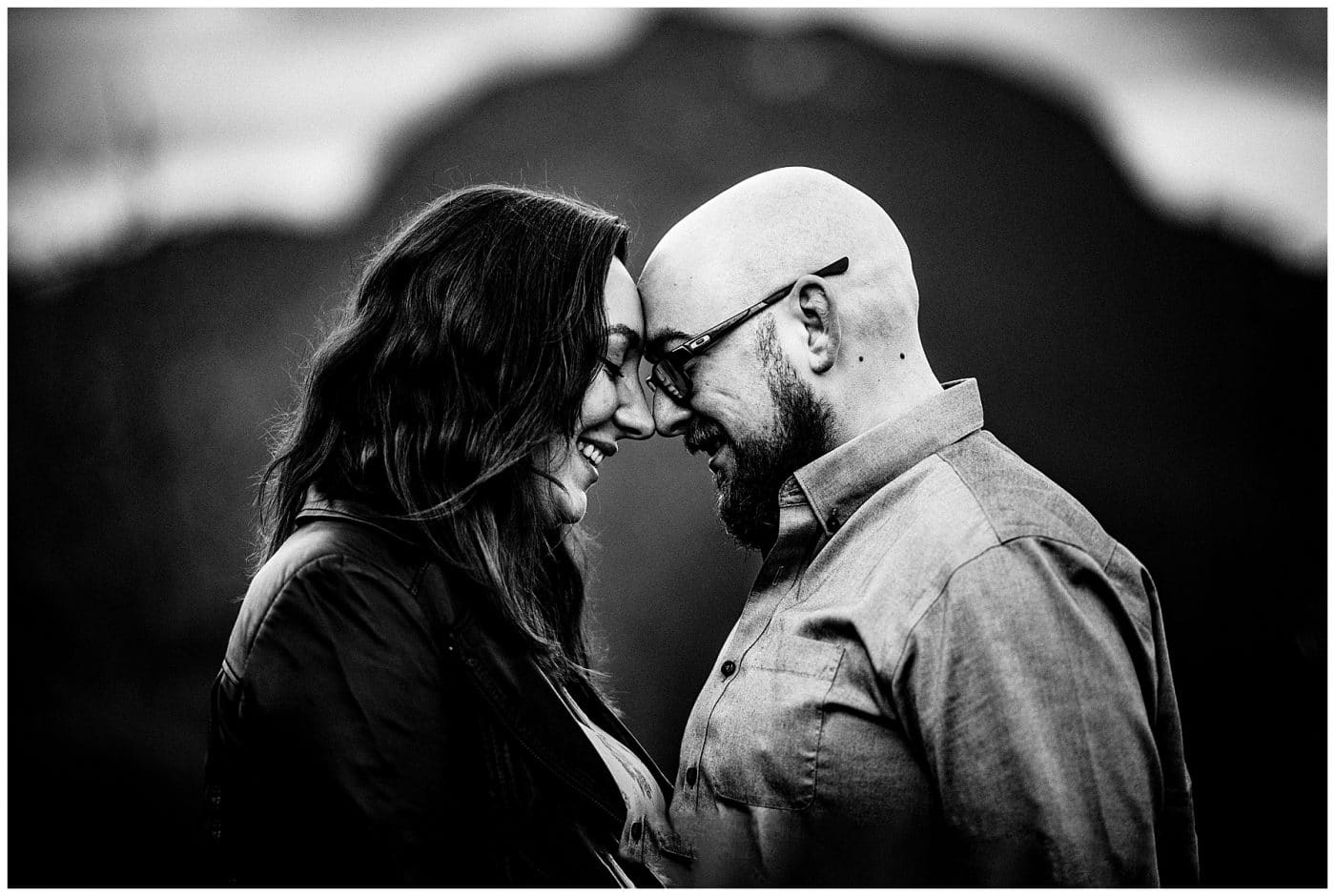 Couple smile and contemplate with heads together at their Sunshine Coast Engagement Session