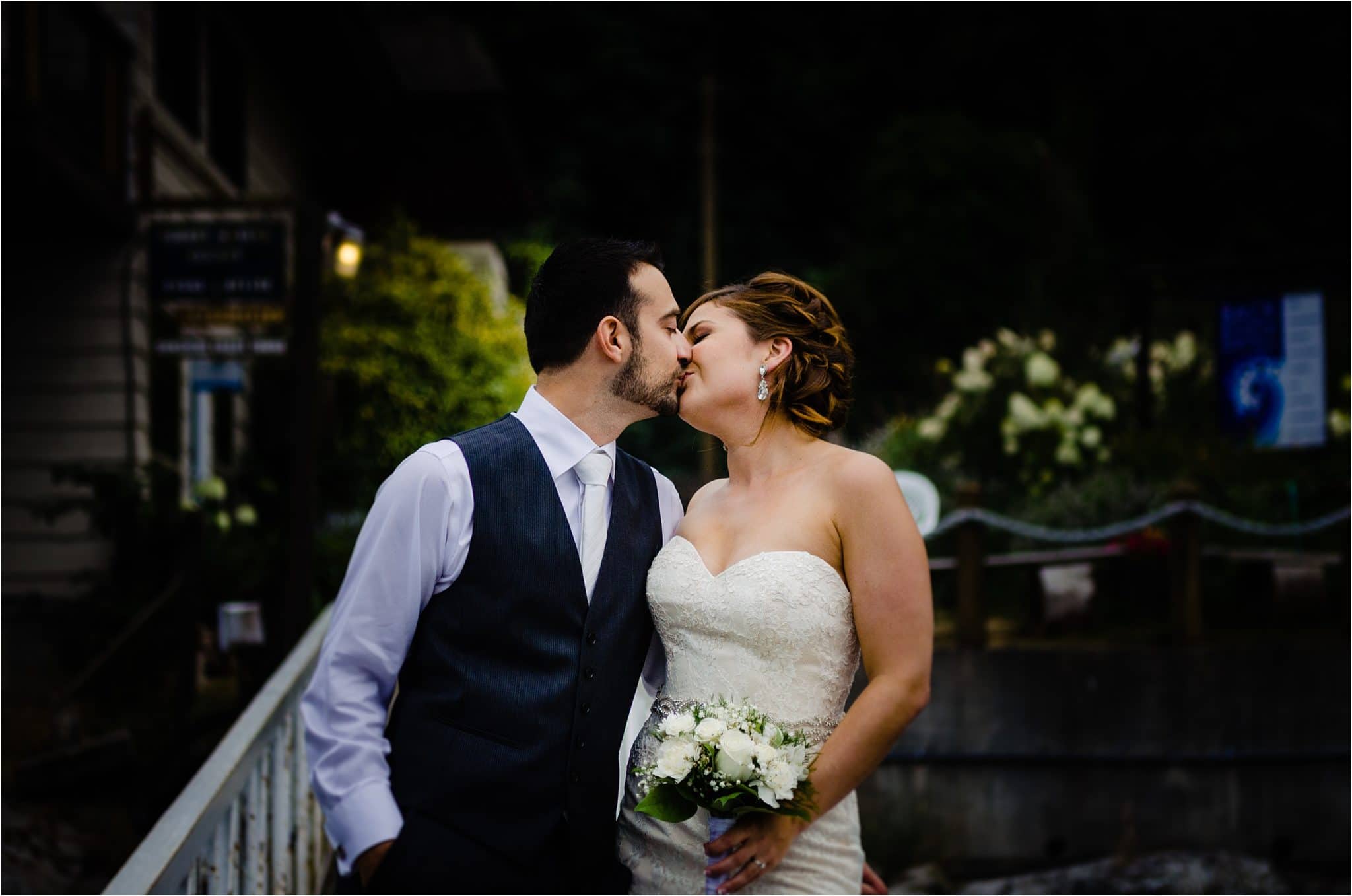 bride and groom kiss