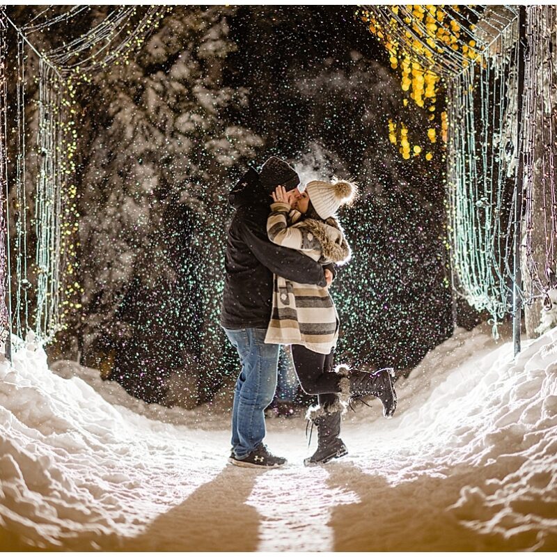 Newly engaged couple kiss in the Light Walk Tunnel on Grouse Mountain