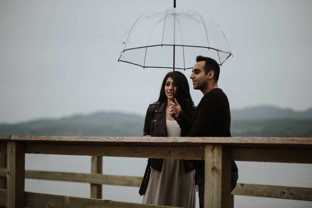 young couple in the rain at an engagment session sunshine coast BC