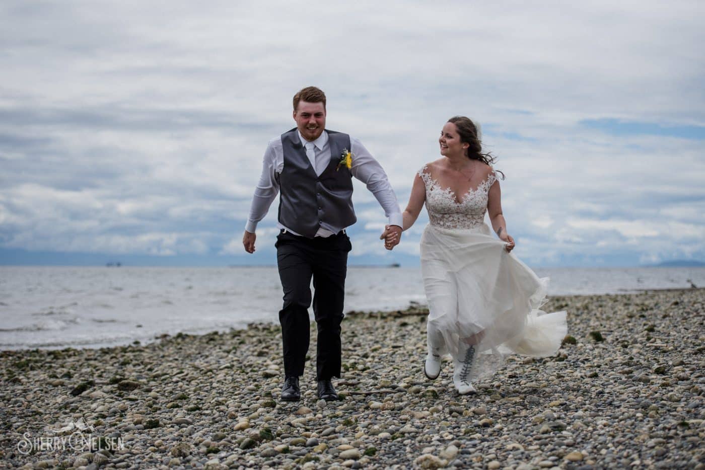 Shane and Shelby's Sechelt wedding included a run along the beach in happiness for the wedding photos for their Sechelt BC wedding