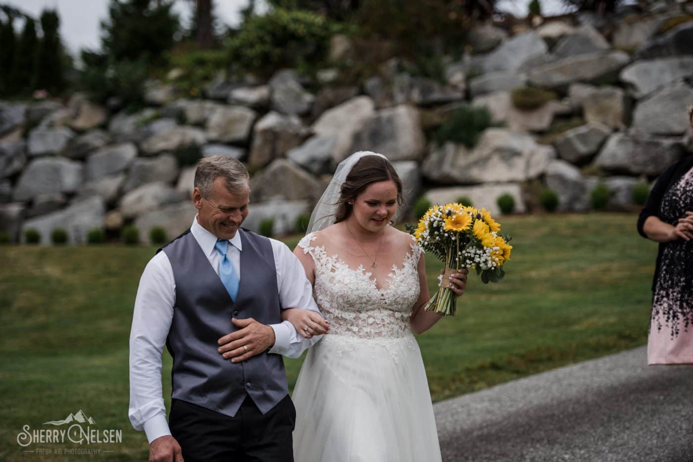 father walks his daughter down the aisle to be married