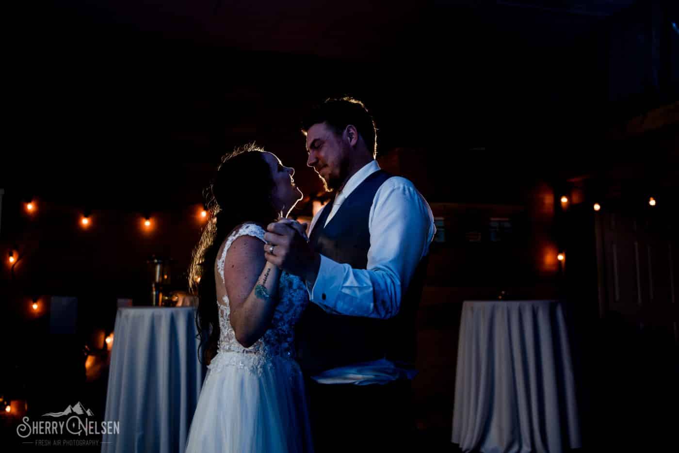 Shane and Shelby at their first dance at their Sechelt wedding by fairy lights