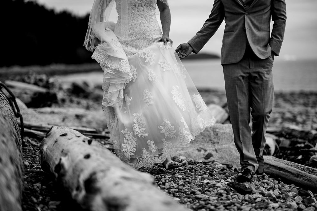 bride and groom as they walk the beach at sunshine Coast wedding, Gibsons BC