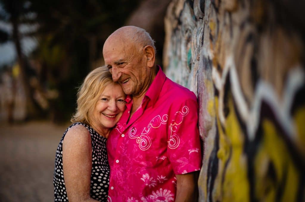 Couple smile at the camera for their 59th anniversary story portrait