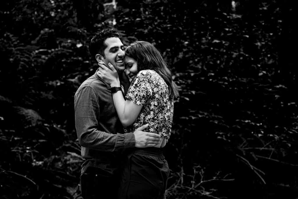 man and woman snuggle each other with huge smiles immediately after he asks her to marry him in a forest on the Sunshine Coast in this surprise proposal shot by Sherry Nelsen of Fresh Air Photography