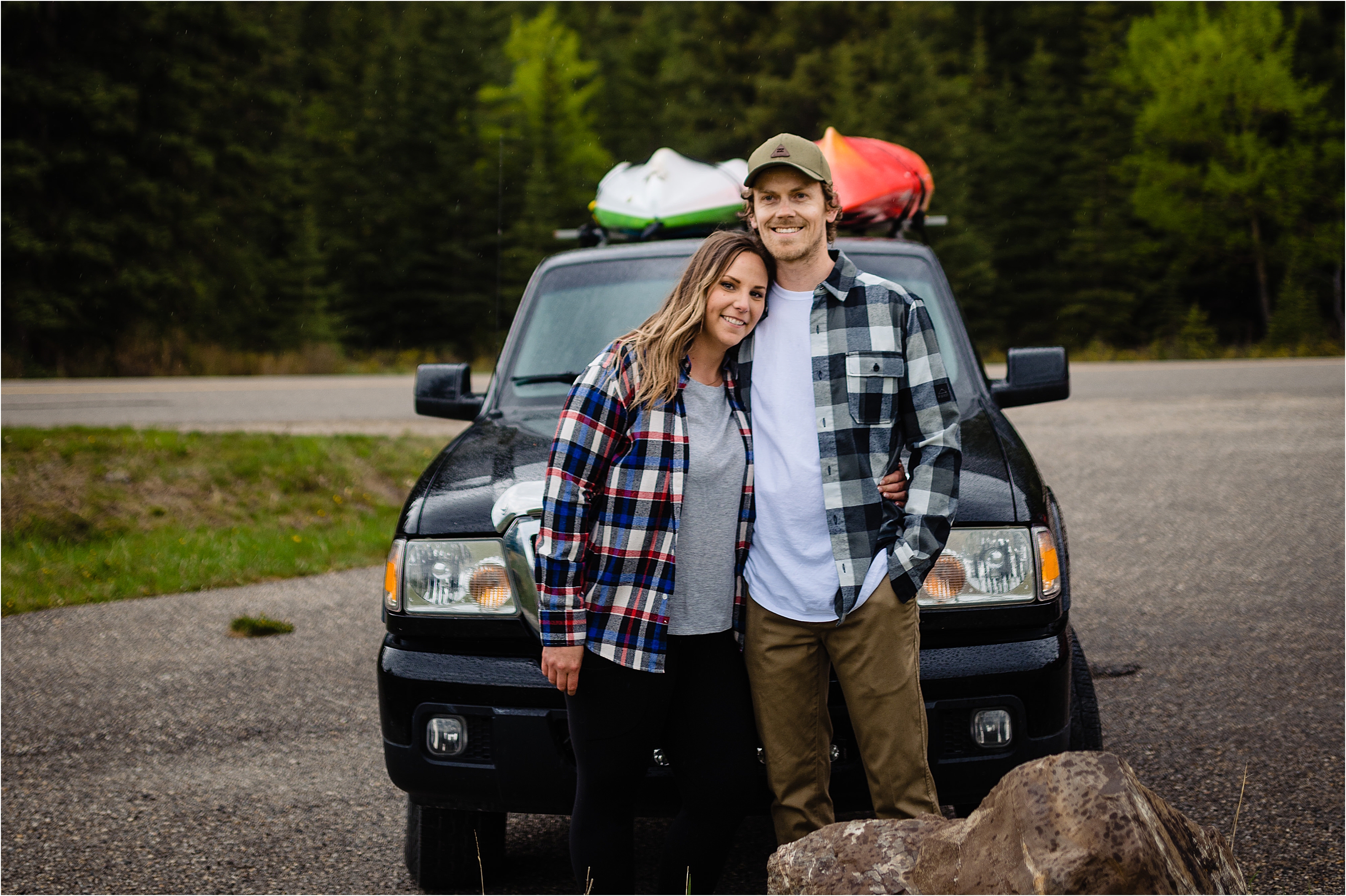 Banff engagement photos of Yvonne and Tim in front of their adventure truck and kayaks