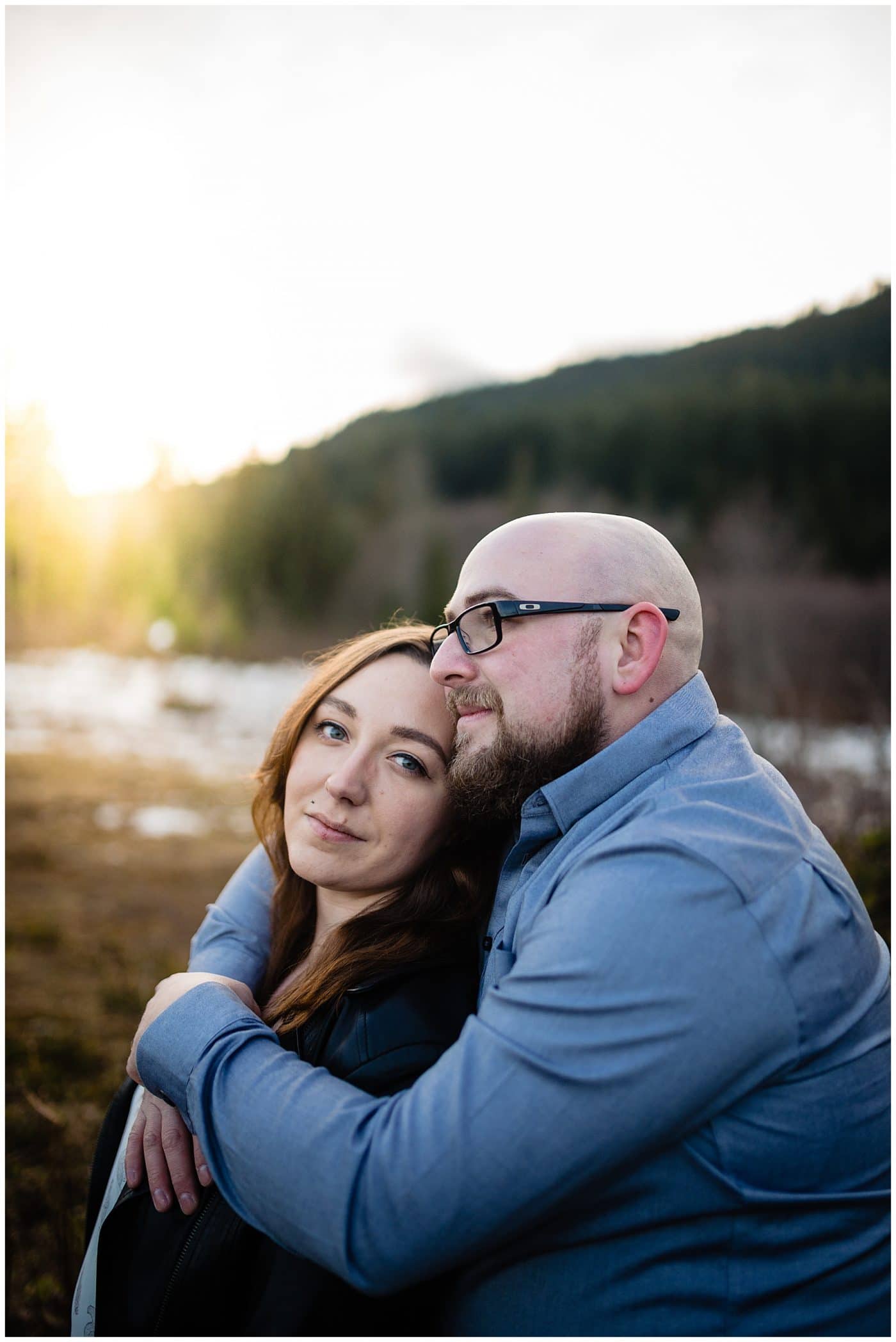 An engagement story where the couple embrace at sunset