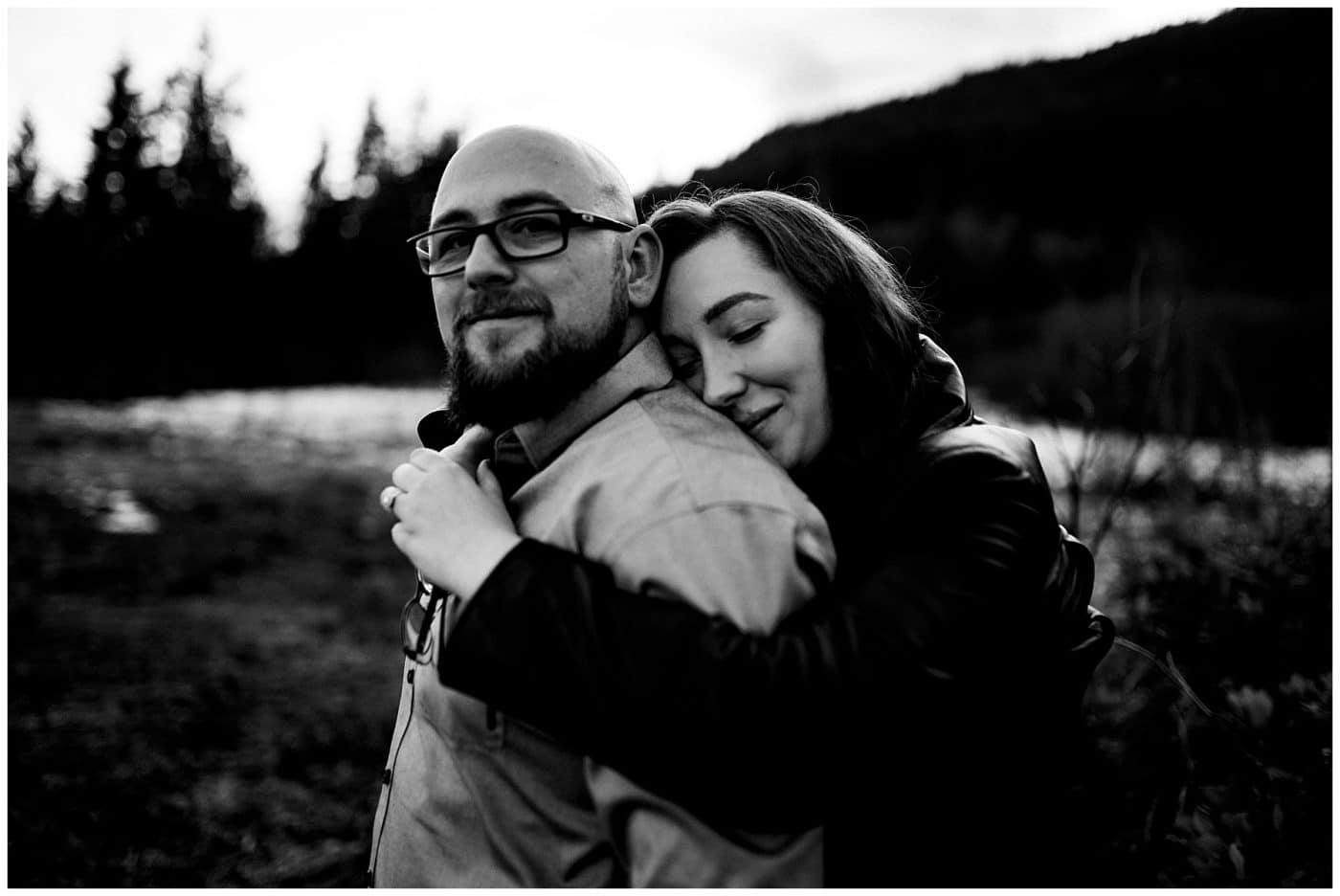 An engagement photo session where the couple embrace and Chad looks very smitten