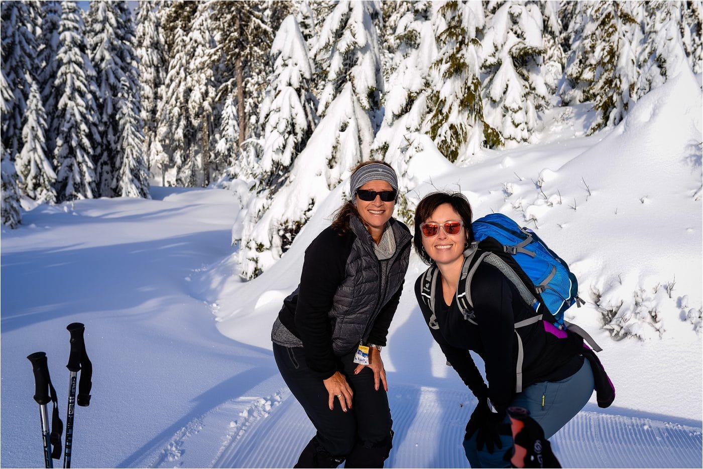 two friends pose in the snow at a Dakota Ridge Adventure