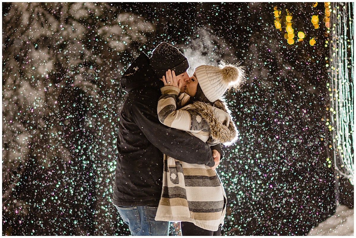 newly engaged Kayla kisses Reece at Grouse Mountain Light Walk