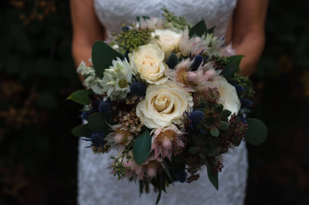 A floral arrangement held by the bride during her Sunshine Coast wedding celebration